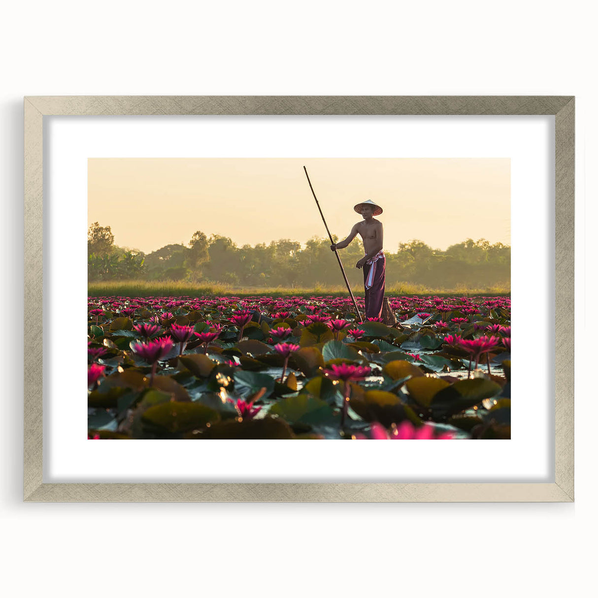 Textured art depicting a Cambodian landscape in muted earth tones on a framed silver mat, suitable for bedroom decor.