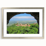 Textured art print of an abstract scenery in muted earth tones on a silver-framed mat, ideal for bedroom decor.