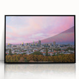 Large abstract wall art depicting the Brisbane skyline in muted gray and blue tones on a framed acrylic.