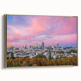 Framed canvas of Brisbane landscape with colorful art and vintage poster style, set in a black frame.