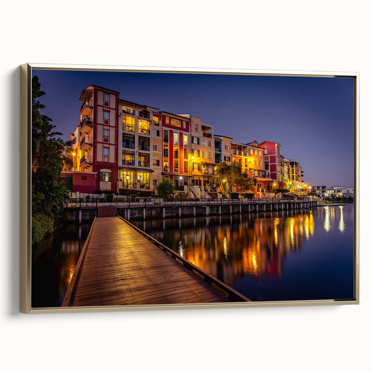 Vintage poster art of Queensland scenery on a framed canvas, featuring a gold frame and colorful imagery.