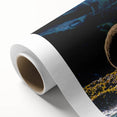Art deco poster of British Columbia scenery on rolled canvas, featuring muted green and blue tones.