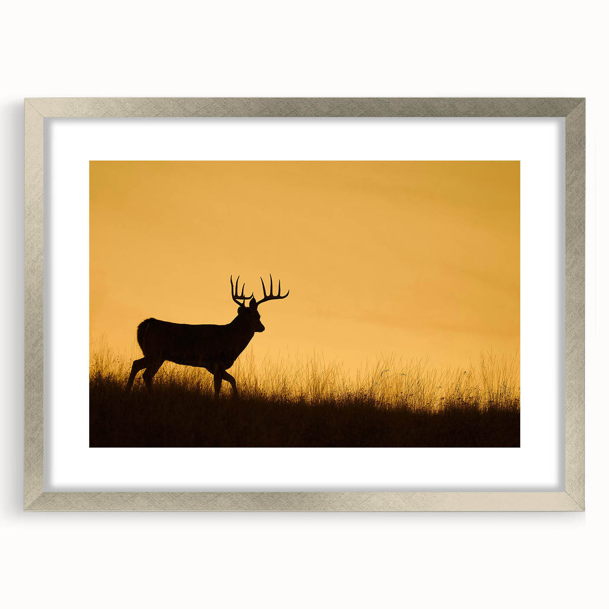 Textured abstract art print of Saskatchewan scenery in muted earth tones, framed in silver, suitable for bedroom decor.