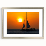 Extra large abstract art print of a Caribbean scenery in silver frame, featuring textured blue and white tones.