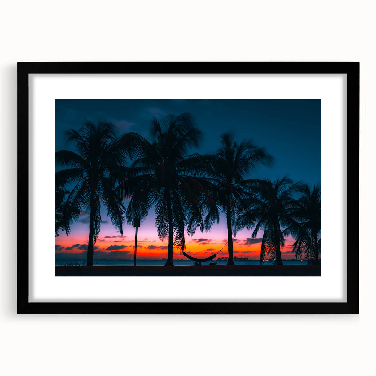 Extra large abstract art print of a Caribbean scenery in vibrant colors, framed in black, ideal for living room decor.