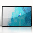 Large abstract wall art depicting a Caribbean scenery in vibrant blue and green tones, framed in black acrylic.