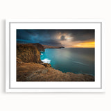 Textured abstract art print of a Caribbean scene in muted blues and greens, framed with a white mat.