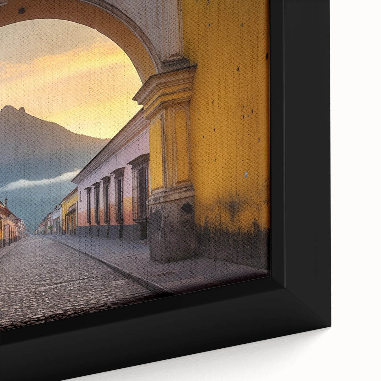 Close-up of a textured, extra large framed canvas featuring a black and colorful Central American scenery.