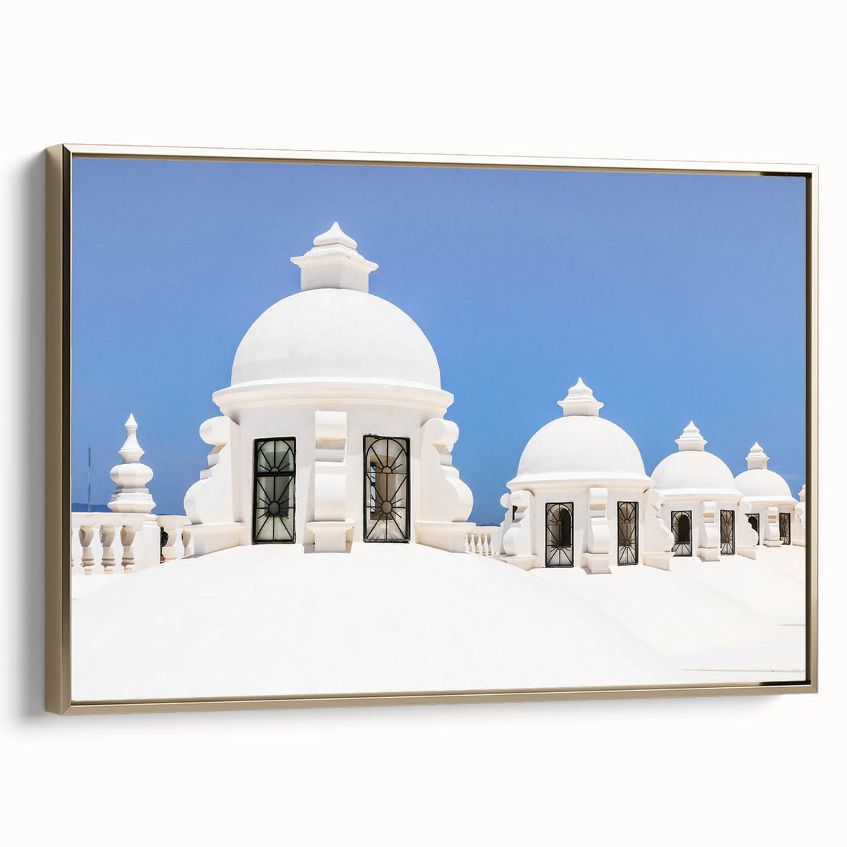 Framed canvas featuring a vintage-style landscape painting of a Central American scenery in black and gold tones.