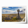 Scenic Cumbria landscape print on rolled canvas, featuring lush greenery and a distant village, suited for dining room decor.