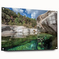 Large abstract wall art of Corsica coastline in muted blue and green tones on acrylic glass.