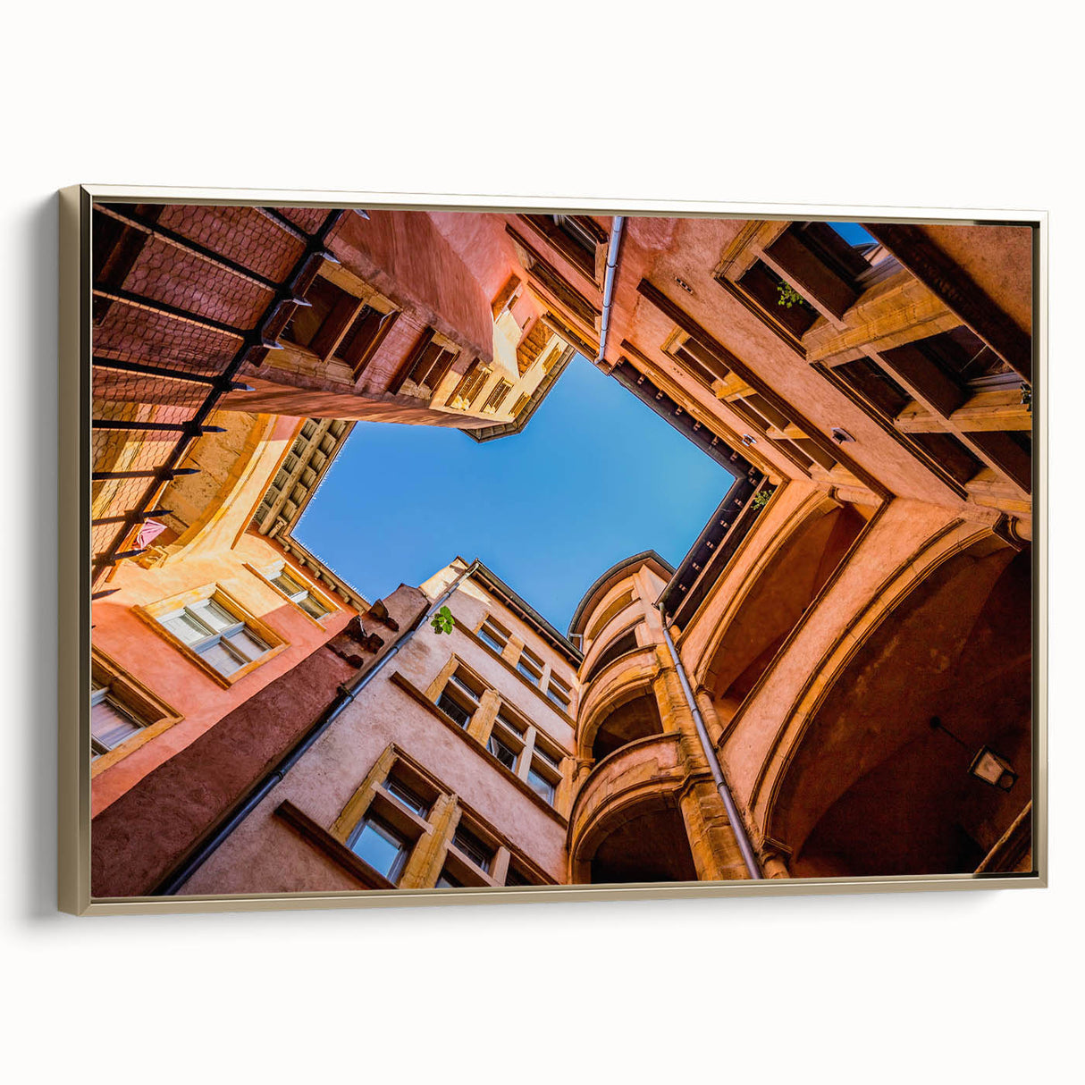 Framed canvas wall art depicting a vintage-style landscape of Lyon with muted gold and black tones, ideal for bedroom decor.