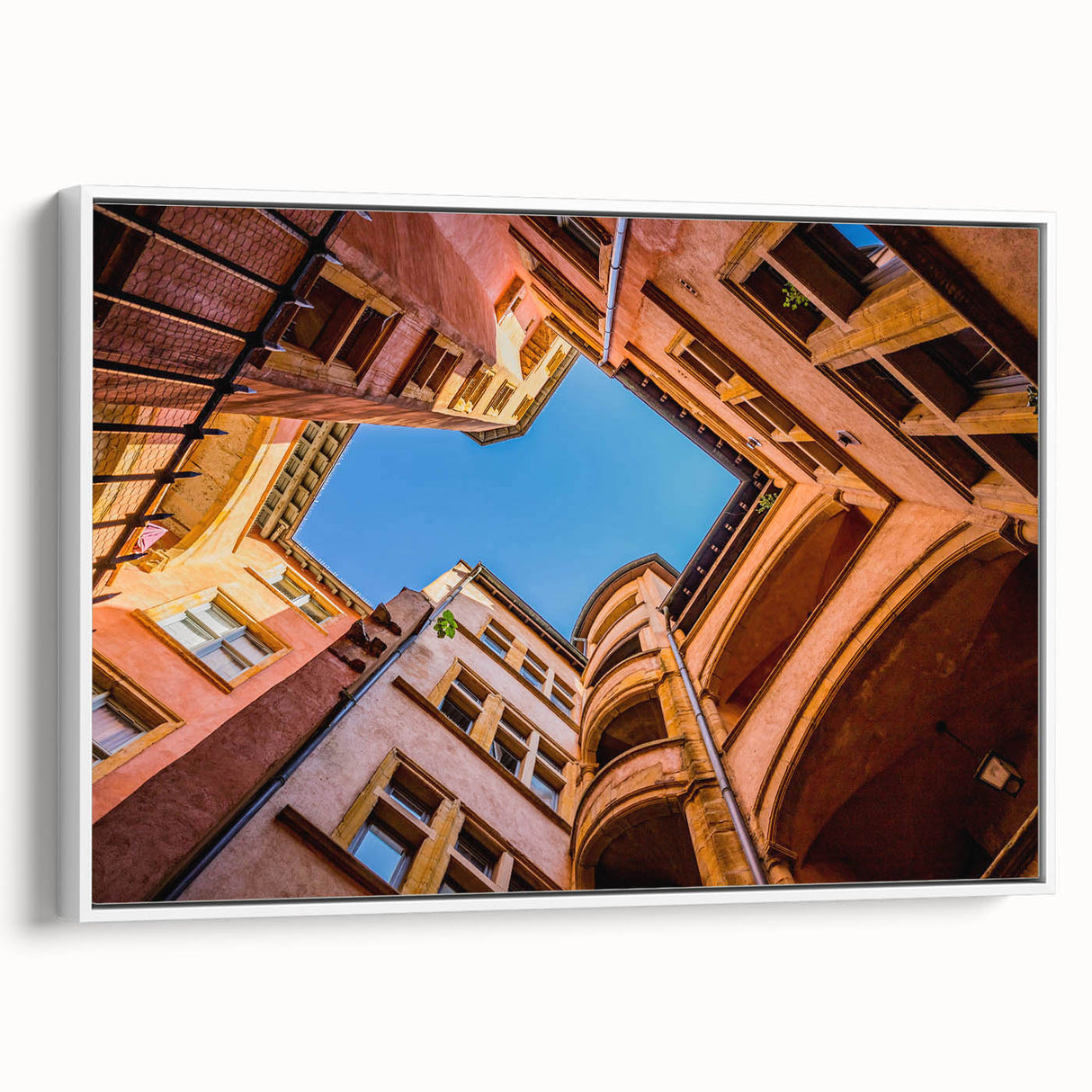 Vintage poster art of Lyon, France in vibrant colors on a large framed canvas, ideal for living room decor.