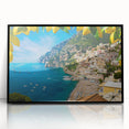 Large abstract wall art of the Amalfi Coast in muted blue and green tones, framed in black acrylic.