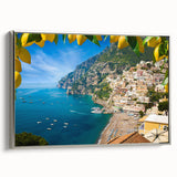 Framed canvas landscape art painting depicting the Amalfi Coast with vibrant blue and pastel yellow tones.