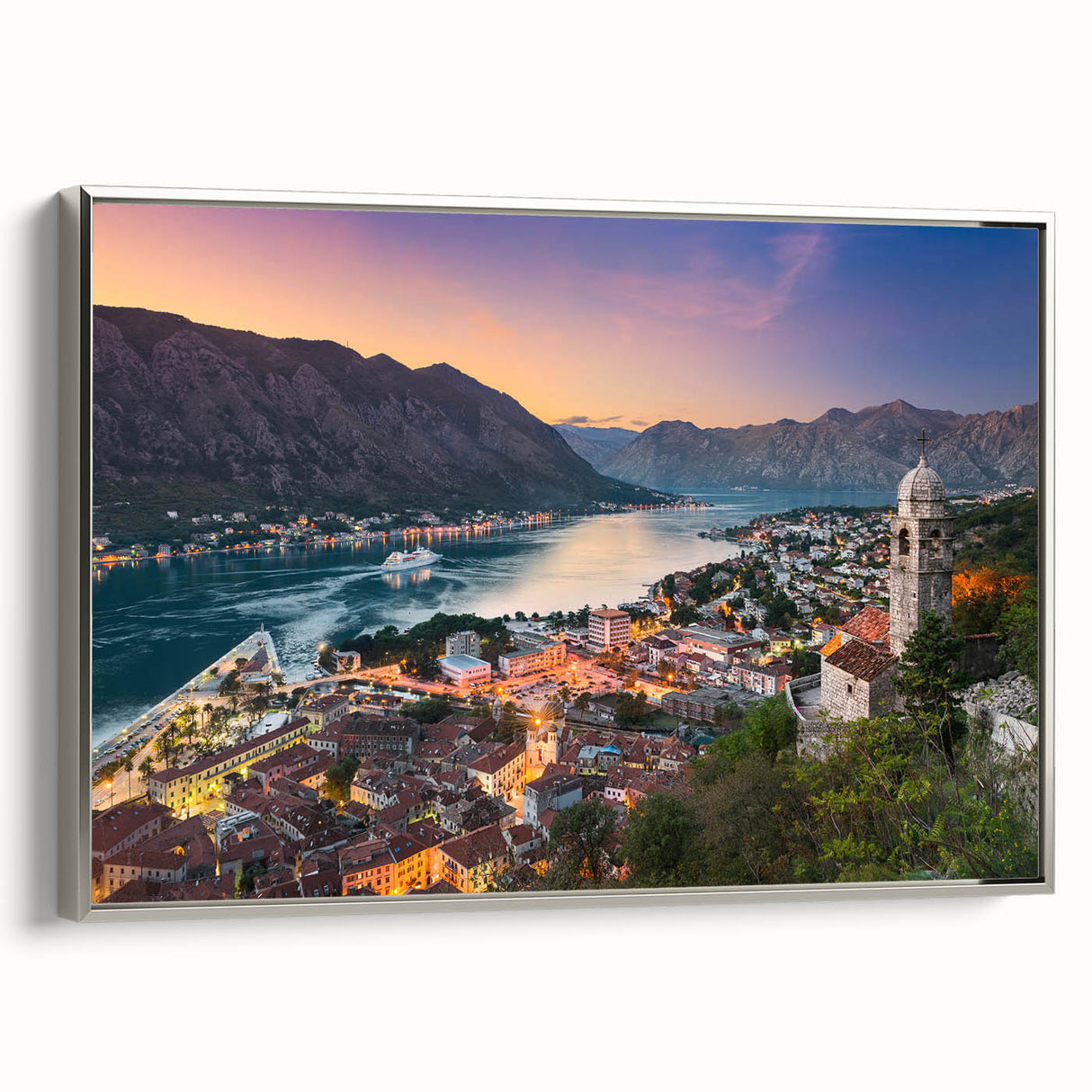 Framed canvas featuring a vintage-style landscape painting of Montenegro, with vibrant colors and black borders.