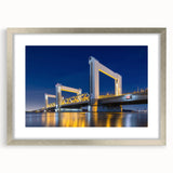 Extra large abstract art print of Amsterdam scenery in textured silver frame, suitable for living room decor.