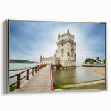 Framed canvas featuring vintage poster art of Lisbon landscape with colorful buildings and black sky.