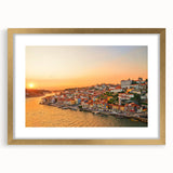 Textured art depicting abstract Porto scenery in muted gold and blue tones, framed with a gold mat, suitable for bedroom art.