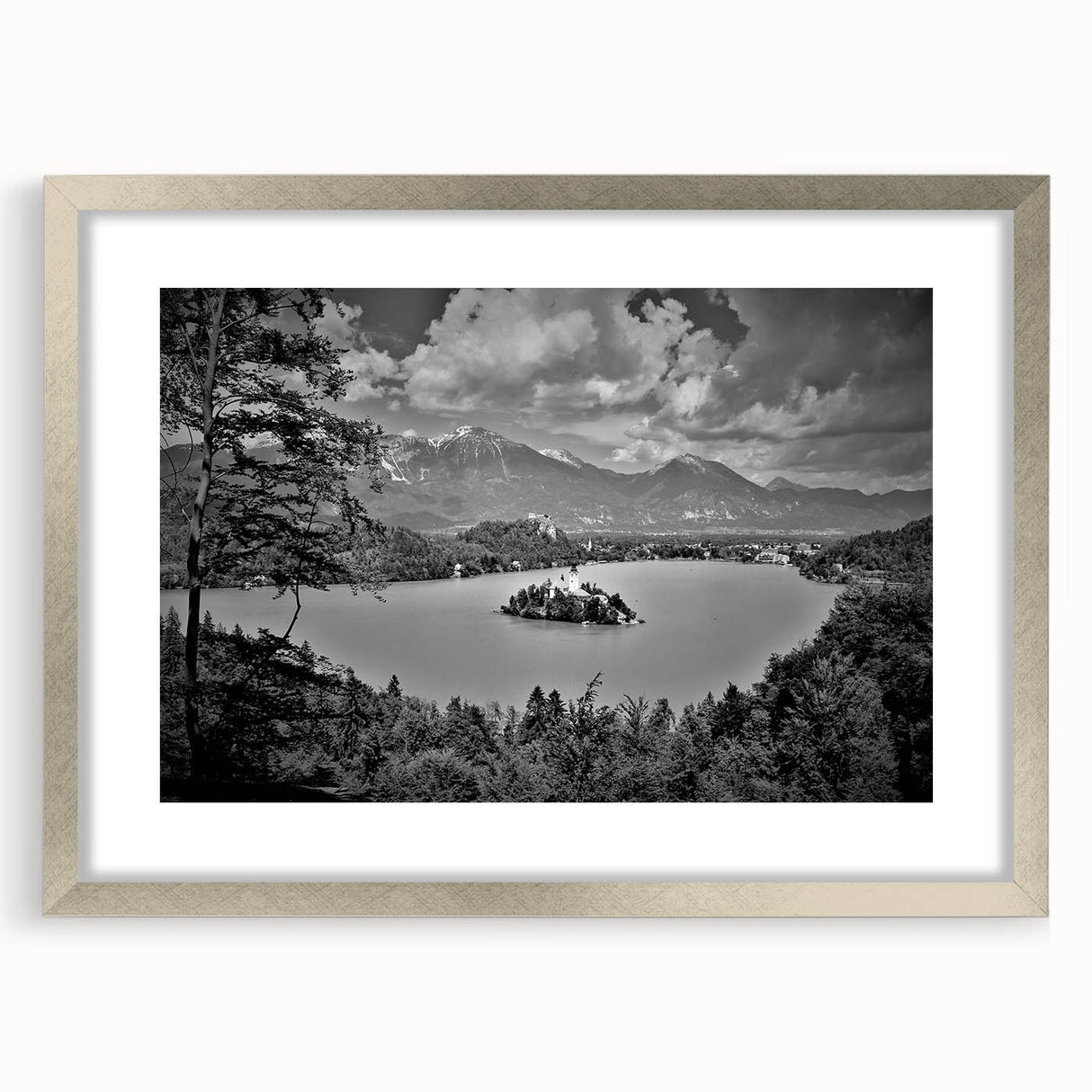 Abstract art print featuring a serene Slovenian landscape in muted green and blue tones, framed in silver.