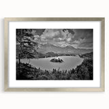 Abstract art print featuring a serene Slovenian landscape in muted green and blue tones, framed in silver.