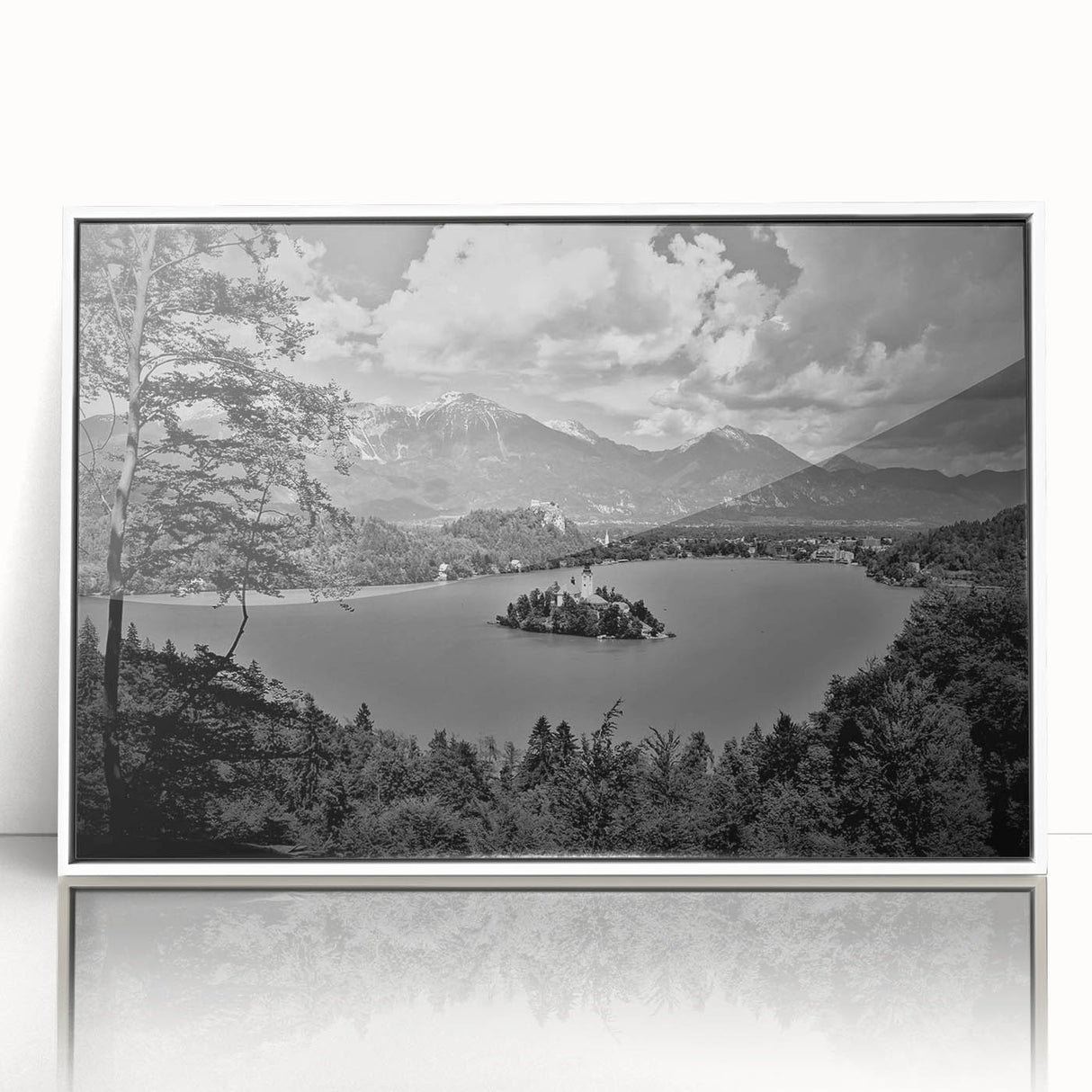 Large art print of a serene Slovenian landscape in muted greens and blues, framed in white acrylic.