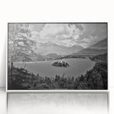 Large art print of a serene Slovenian landscape in muted greens and blues, framed in white acrylic.