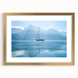 Extra large wall art featuring an abstract print of Geneva's scenery in textured shades of blue and gray, framed in gold.
