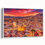 Vintage poster art of Guanajuato, Mexico, featuring colorful buildings on framed canvas, suitable for living room decor.