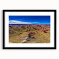 Abstract art print of a colorful South American landscape on textured canvas, framed in black, ideal for living room decor.