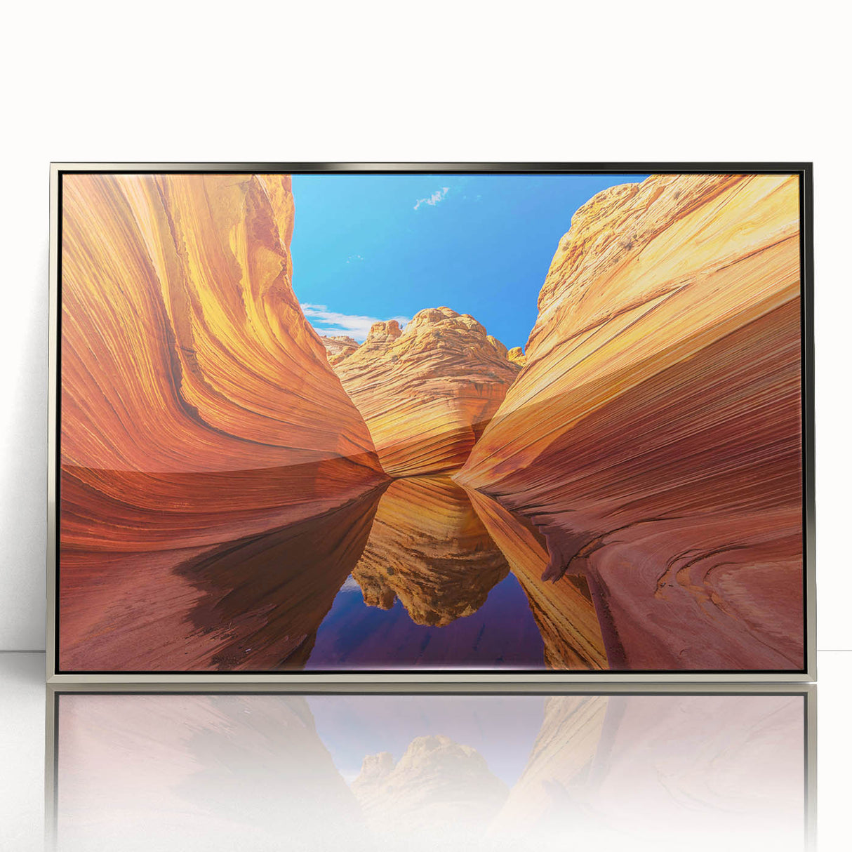 Mid-century modernist art depicting the Coyote Buttes in Arizona with muted earth tones on a silver-framed acrylic print.
