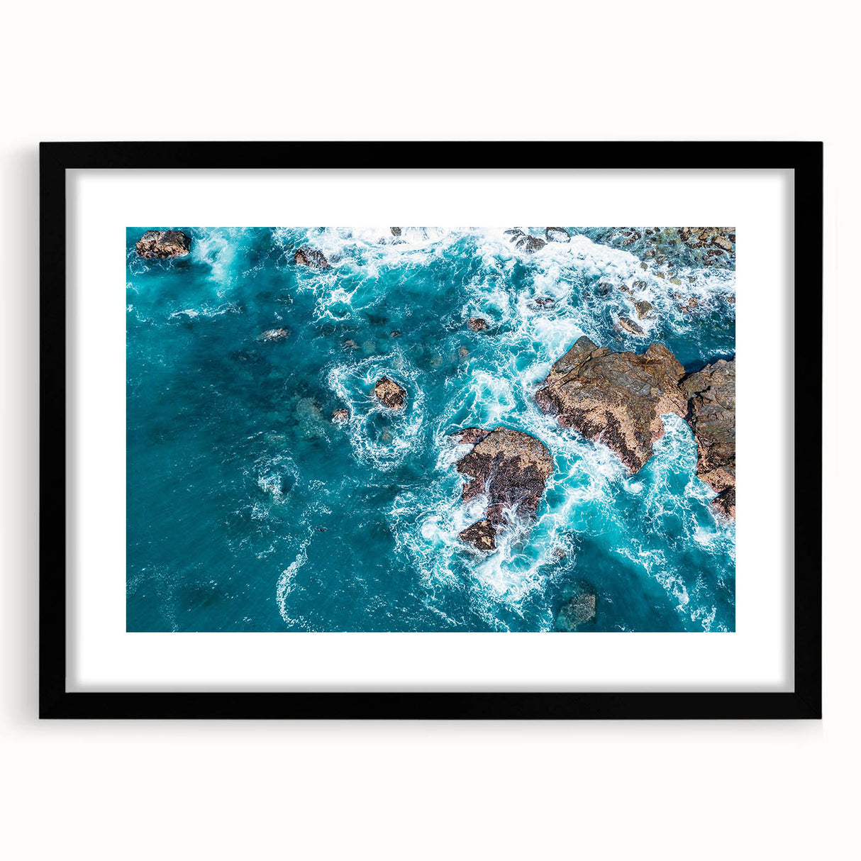 Extra large, textured abstract art print of Big Sur in colorful hues on a black framed canvas, ideal for living room decor.