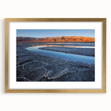 Extra large abstract art print of Death Valley in textured tones of brown and beige, framed in gold.