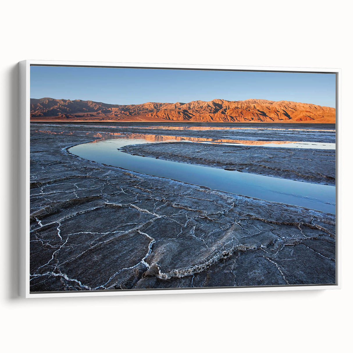 Vintage poster art of Death Valley in a white framed canvas, featuring muted earth tones, ideal for living room decor.