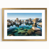 Extra large abstract art print of Lake Tahoe in textured style with muted blue and green tones, framed in gold.