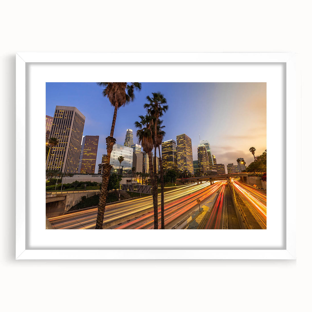 Abstract art print of Los Angeles skyline in muted gray and blue tones on a framed white mat.