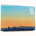 Abstract depiction of Denver skyline in muted blue and gray tones on large acrylic glass.