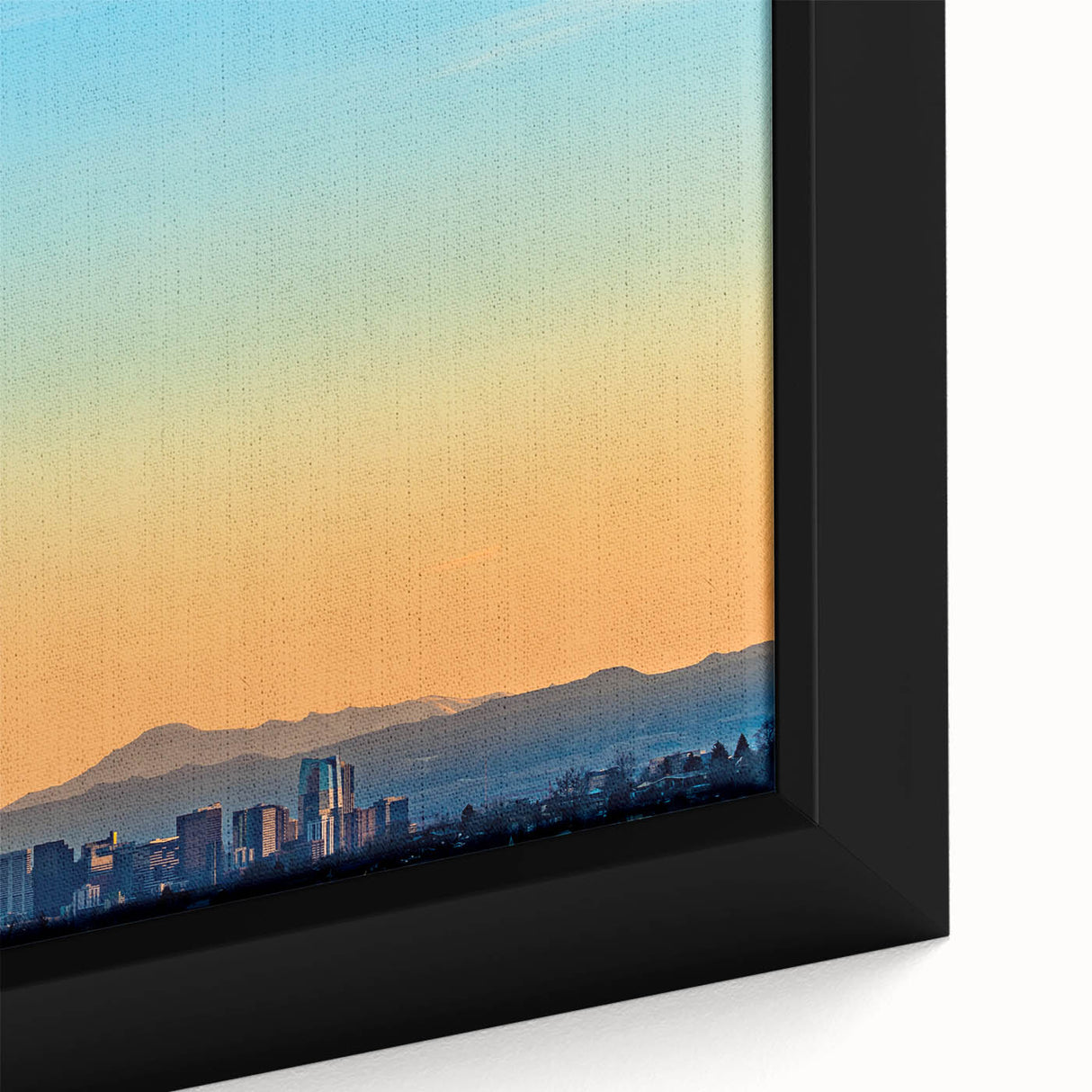 Black wall art featuring a textured depiction of the Denver skyline in colorful hues on a framed canvas.