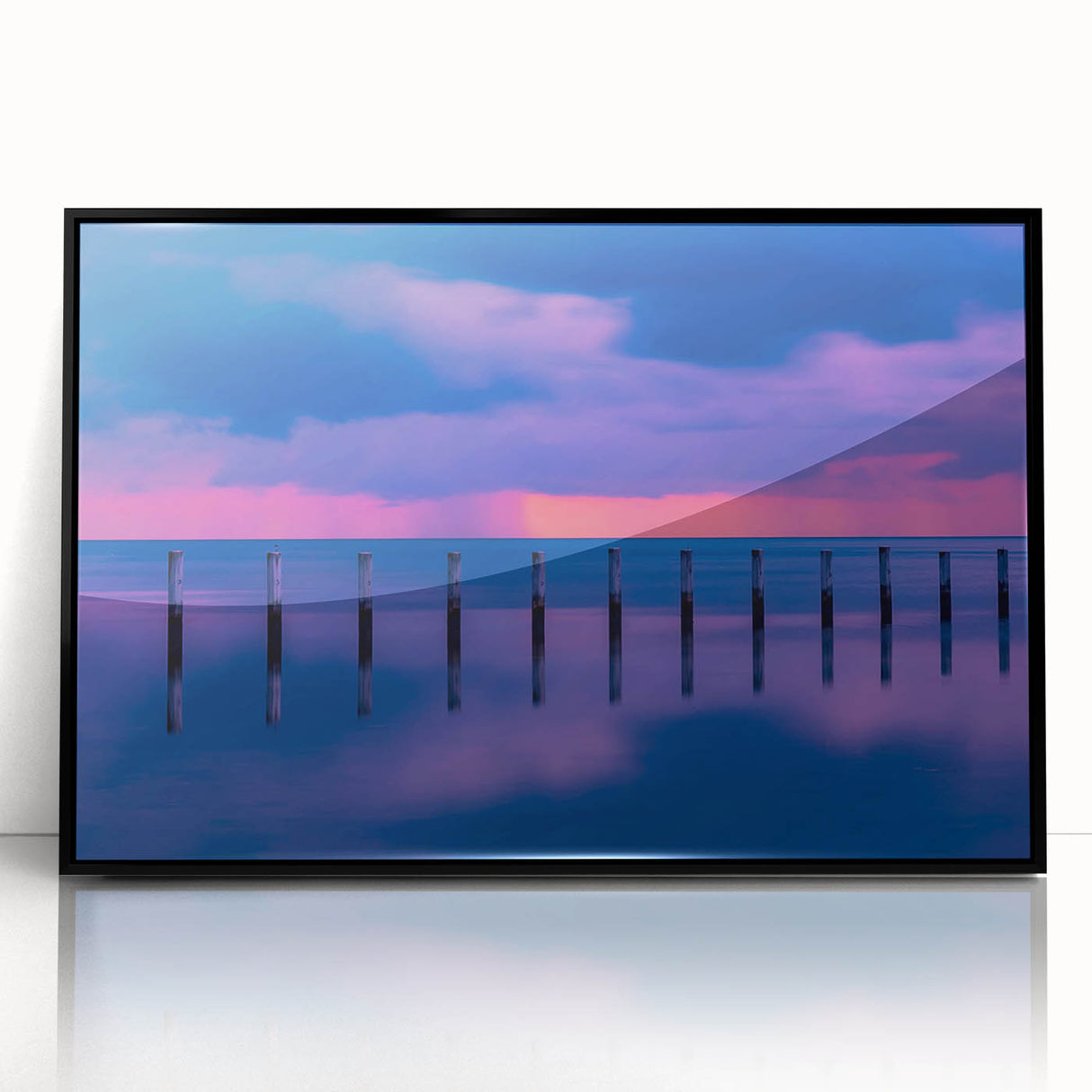 Large abstract wall art depicting the Florida Keys in muted oceanic blues and greens, framed in black acrylic.