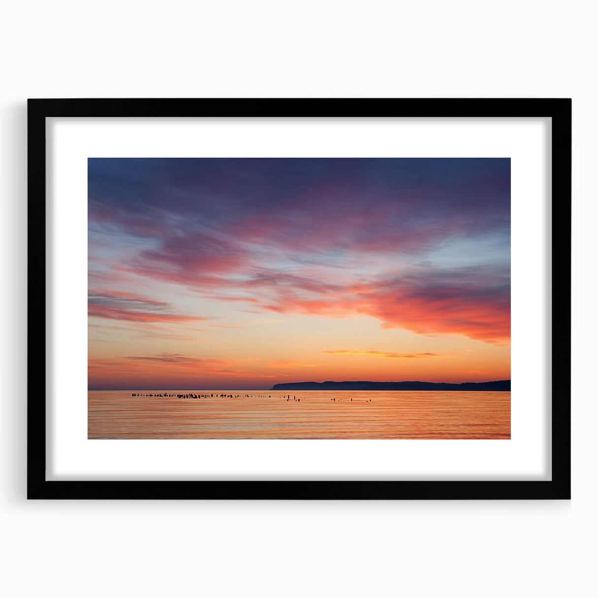Abstract art print of Lake Michigan with vibrant, colorful textures on a large black-framed canvas.