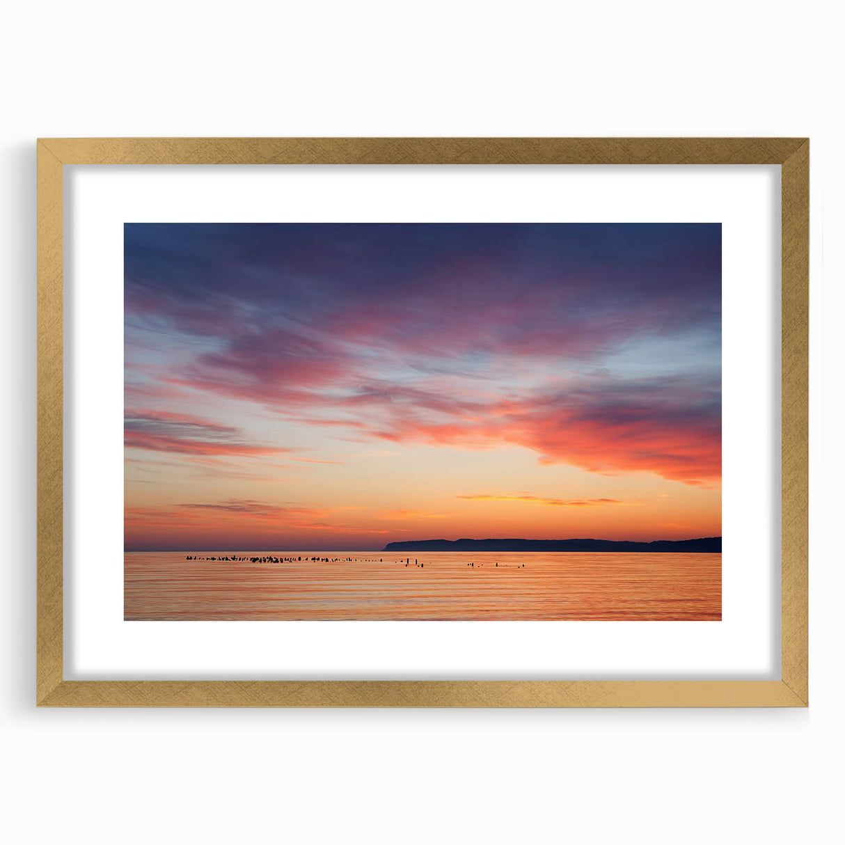 Extra large abstract art print of Lake Michigan, featuring textured blues and grays, in a gold frame.