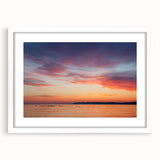 Abstract art print of Lake Michigan with muted blue and gray tones on a white framed poster, suitable for dining room decor.