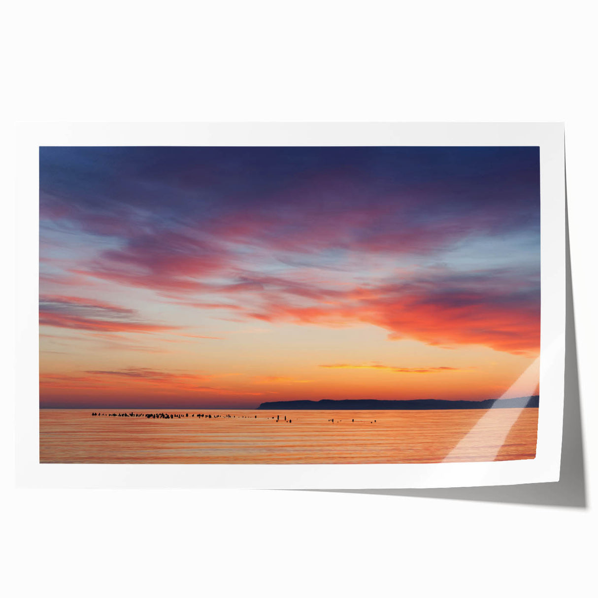Rolled print of Lake Michigan, featuring soft blue and gray tones.