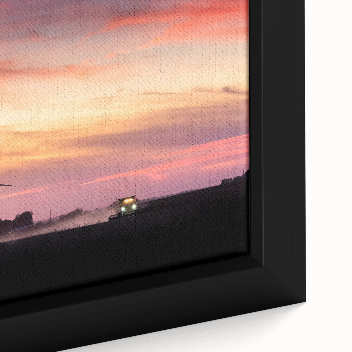 Close-up of a framed canvas featuring a textured Iowa landscape in black with colorful art accents.