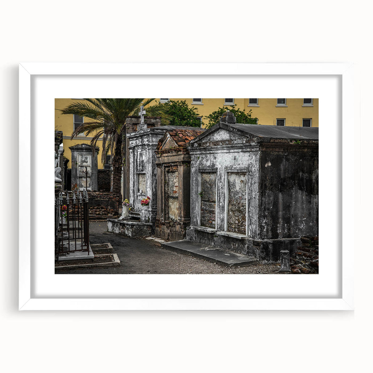 Abstract art print of New Orleans with vibrant blues and oranges on a white framed canvas, ideal for dining room decor.