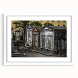 Abstract art print of New Orleans with vibrant blues and oranges on a white framed canvas, ideal for dining room decor.