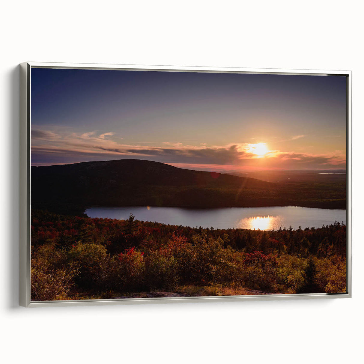 Vintage poster art of Acadia, Maine, with colorful landscape on black background, framed in silver.