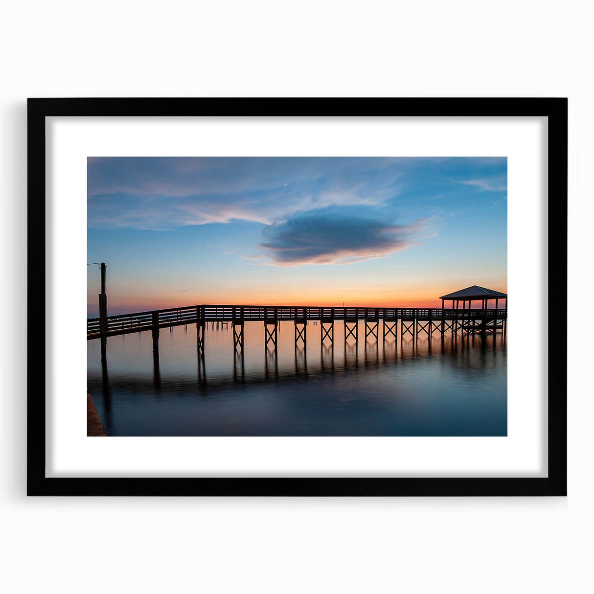 Abstract art print of St. Louis skyline in vibrant colors on a large canvas, suitable for living room decor.