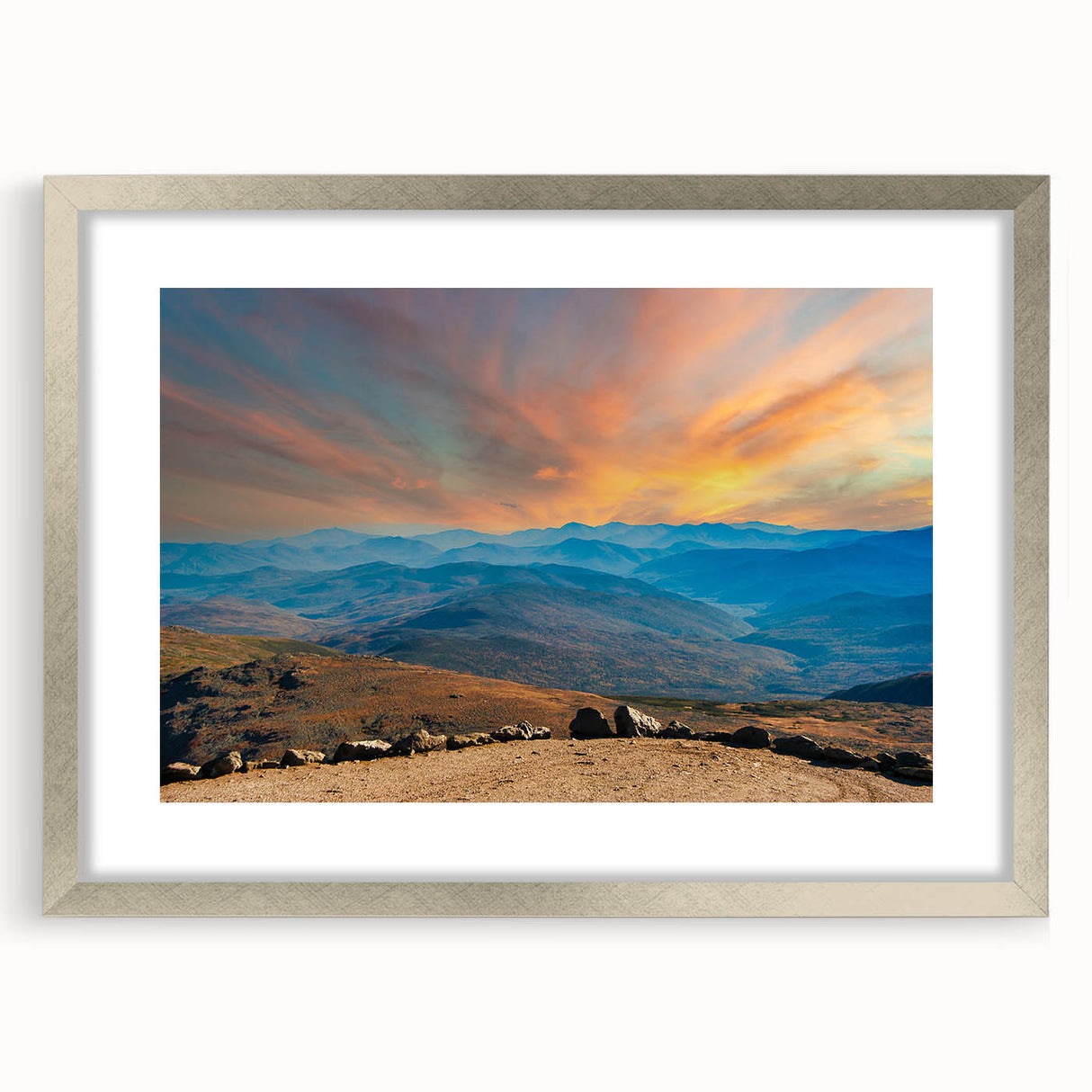 Textured art print depicting abstract scenery in muted earth tones, framed in silver, suitable for bedroom decor.