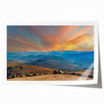 Rolled print of a New Hampshire landscape with lush greenery and floral elements in soft earth tones.
